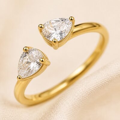 Close-up of two water-drop CZ open ring in 18K gold-plated finish